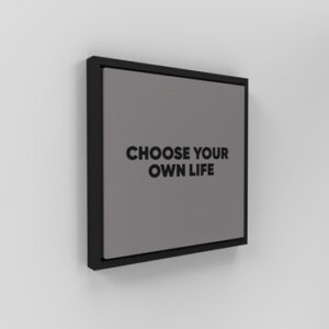 Mock-up-of-sign-board-choose-your-own-life-hanging-on-a-white-wall-background