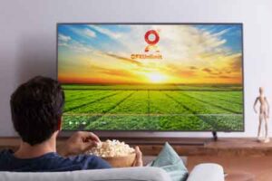 medium-shot-man-watching-movie-on-television