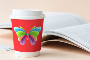 cup-on-desk-with-book-mock-up