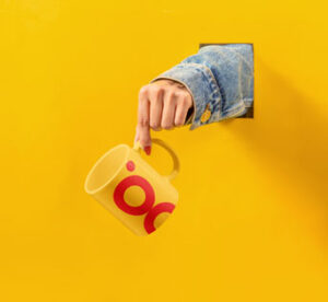 hanging-cup-in-woman-hand-mock-up
