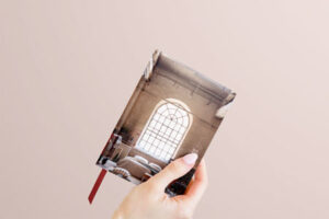 small-book-in-woman-hand-mock-up