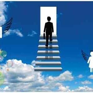 Young man climbing up stairs holding bag