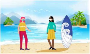 Two girls standing talking each-other on bank of sea