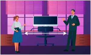 Man and woman standing across big computer screen