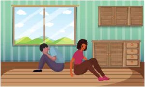 Boy and girl sit back to back on floor in room