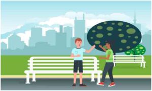 Young guys standing to talk at roadside bench